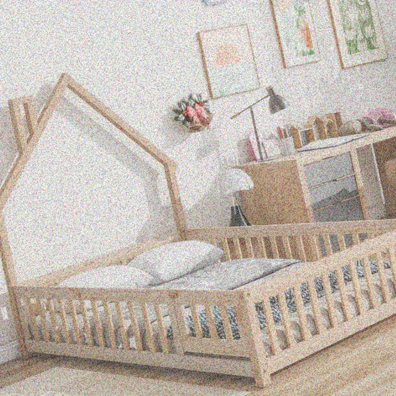 Natural Floor Bed with a Headboard Shaped Like a Full House And a Fence.