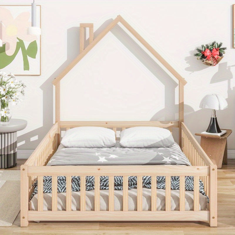 Natural Floor Bed with a Headboard Shaped Like a Full House And a Fence.